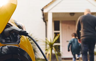 Electric car charging outside family home