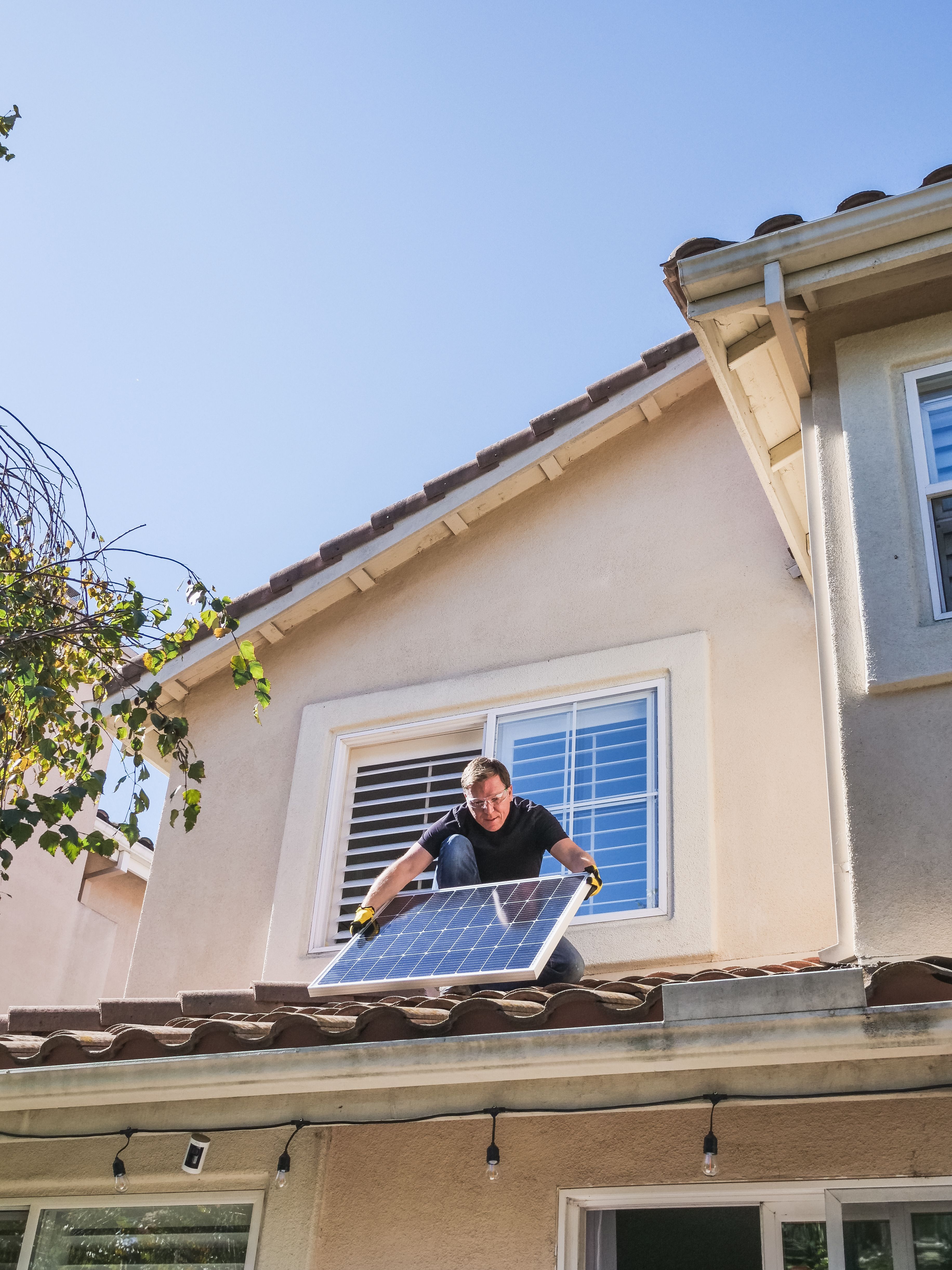 Man installing solar panels